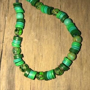 Green gem and green clay bead bracelet.